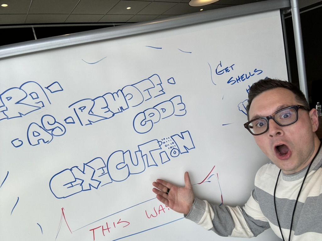 Ken at a whiteboard reading Infrastructure as Remote Code Execution